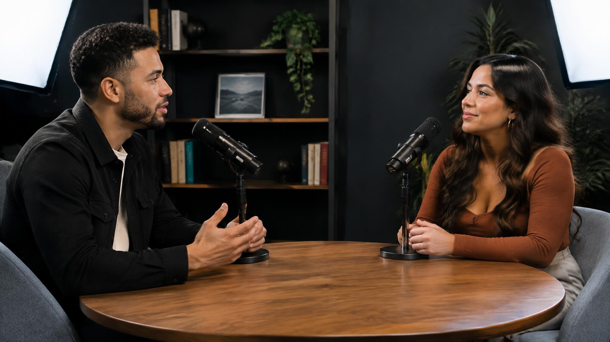 Two people sitting for a recorded interview segment